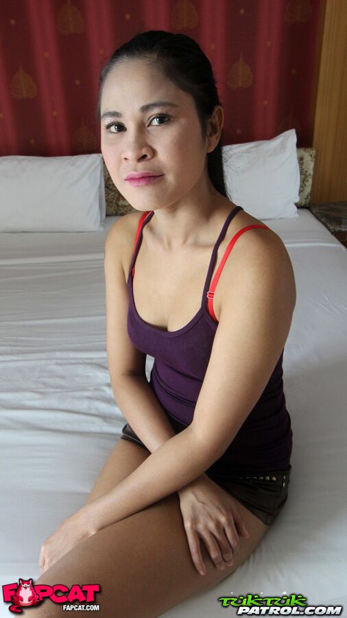 Thai Solo Girl Hesitantly Gets Naked On A Bed For A Sex Tourist  