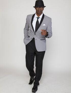 Ebony porn stud Sean Michaels posing suavely while wearing a classy suit