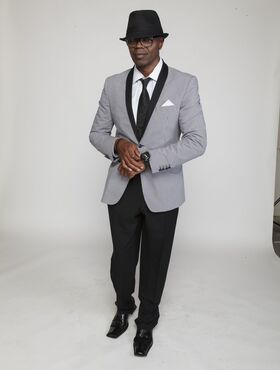 Ebony porn stud Sean Michaels posing suavely while wearing a classy suit