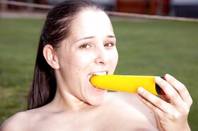 Cute teen Kelly denudes her melons and shoves a yellow toy in her twat