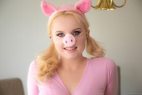 Blonde girl River Fox strips naked attired in a Miss Piggy costume