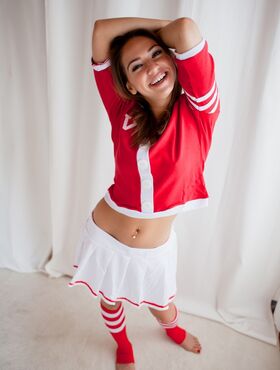 Cute brunette cheerleader flashing young tits and ass in sports socks