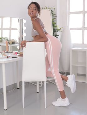 Ebony with a lovely bosom Luna Corazon reveals her long legs and sweet muff