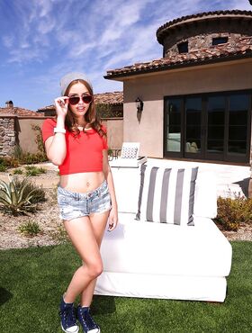 Cute teen girl Natasha White baring small tits and nice ass in backyard