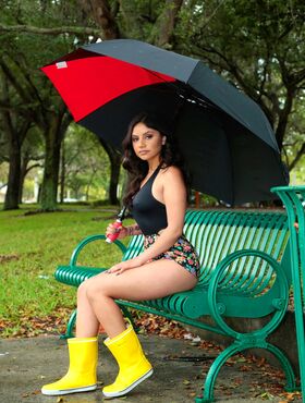 Cute young Latina bares her booty for a hot big cock ride wearing rubber boots