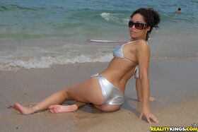 Latin beauty Mercedes Cash showing ass in silver bikini on the beach