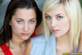 Pretty blonde babe with shaved slit Emma Mae has some lesbian fun outdoor