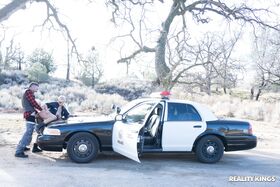 Blonde Spanish copper Bridgette B fucks a hot criminal on the cop car
