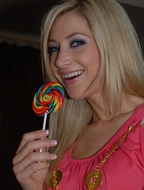 Busty blond lesbians sucking on lollipops and perky nipples