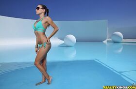 Lovely girl in glasses and bikini Celeste Star enjoys swimming in pool
