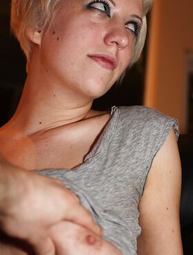 Short-haired blonde Cherry Torn revealing her big tits and shaved slit