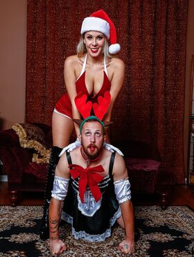 Hot MILF in Xmas outfit Nikki Brooks humiliates a sex slave in a maid uniform