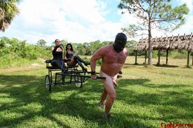 Femdoms Esmi Lee & Venus give a lesson to their naked muscular slave outdoors