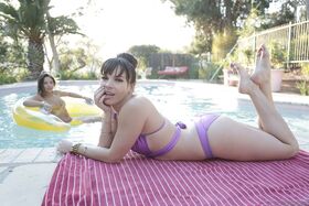 Mature hottie Dana DeArmond kissing this adorable brunette girl in the pool