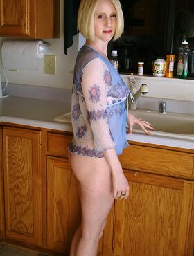 Playful housewife Lydia washing her incredible body in the kitchen sink