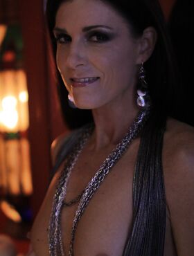 Mature brunette India Summer shows what lives beneath her long dress