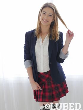 Smiling American schoolgirl Kristen Scott strips and lubes up her body