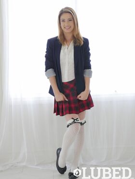 Solo girl Kristen Scott takes off her schoolgirl uniform except for her socks