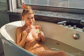 Adorable blonde teen Nancy A takes a bath in a tempting manner