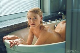 Adorable blonde teen Nancy A takes a bath in a tempting manner