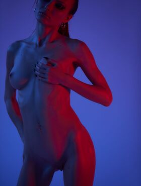 Blonde Jolie Webb peels off her black lingerie to show her naked slender body