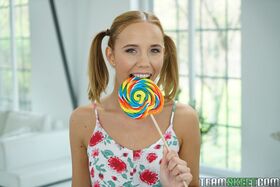 Petite teen Poppy Pleasure licks her lollipop before getting slammed