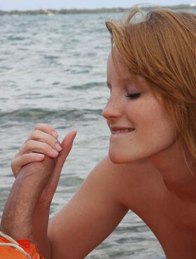 Cute 18 year old ginger Katey Grind wanks and sucks huge penis on the beach