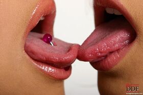 Carli Banks and her lesbian girlfriend tongue kiss before getting naked