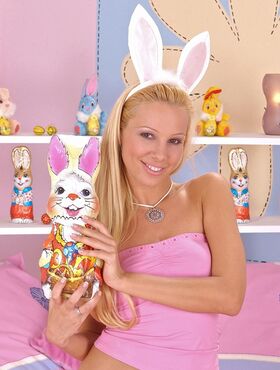 Blonde female Sandy undresses and fingers herself wearing rabbit ears
