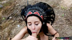 Naked gf Cassie Fire wears a headdress during a POV blowjob in the woods