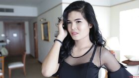 23 year old horny Thai ladyboy with raven hair andfake boobs striptease
