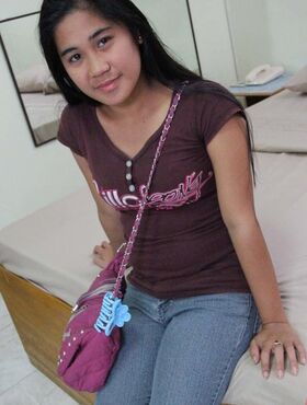 Filipina amateur Maya kneels on her bed after taking off all her clothes