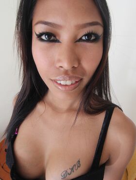 Hot Asian girl with a tattooed booty wears cum on her face during POV action