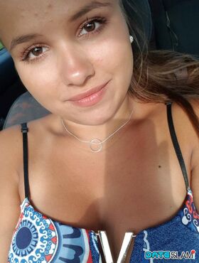 Young looking Latina girl Olivia hides her huge tits while taking selfies