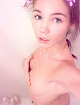 Amateur model Lovenia Lux takes clothed and topless selfies