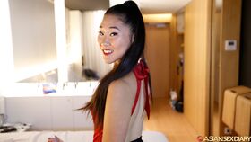 Asian chick in a black miniskirt gets undressed before POV sex on a bed