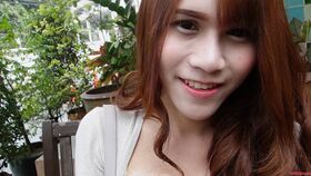 18 year old sexy Thai with long red hair and busty ladyboy strips