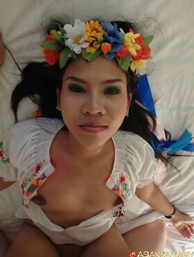 Asian chick Aziza replaces flowers on her head with cum on her pussy