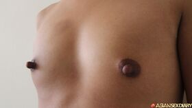 Petite Asian amateur Nap sport erect nipples during POV sex with a Farang