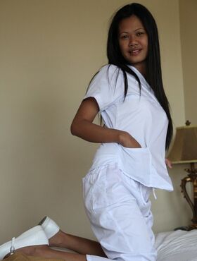 Sexy young filipina nurse Joanna doffs uniform pants to show her trimmed pussy