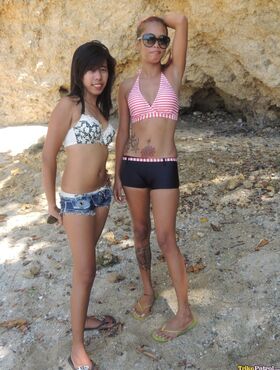 Hot little Asian sluts Shanelle & Bubbles pose & preen in skimpy beach outfits