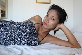Slim Filipina female takes off her dress and sexy underthings to get naked