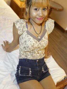 Lovely amateur Thai doll Jean strips to her sexy panties and poses