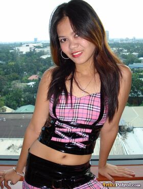Cute Filipina chick bends over for a no panty upskirt in black boots