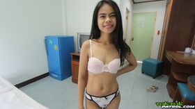 Petite Thai teen Ann2 puts the focus on her twat as she lays naked on a bed
