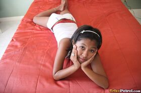 Cute Filipina girl Trixie slides her red underwear aside to show her pussy