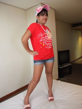 Sexy Filipina Charm reveals her tasty cunt and poses in a red t-shirt