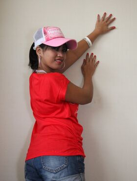 Sexy Filipina Charm reveals her tasty cunt and poses in a red t-shirt