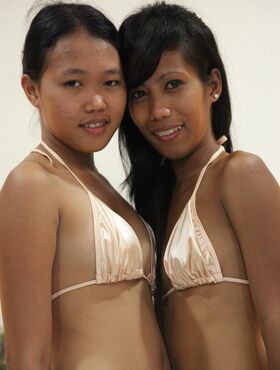 Slim Filipina girls Jeremay and Mayka free tight pussies from bikini bottoms