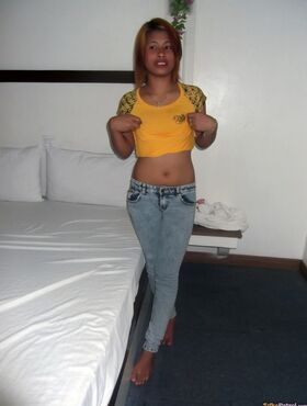 Big mouth filipina Wella takes off her clothes to show nice tits on the bed